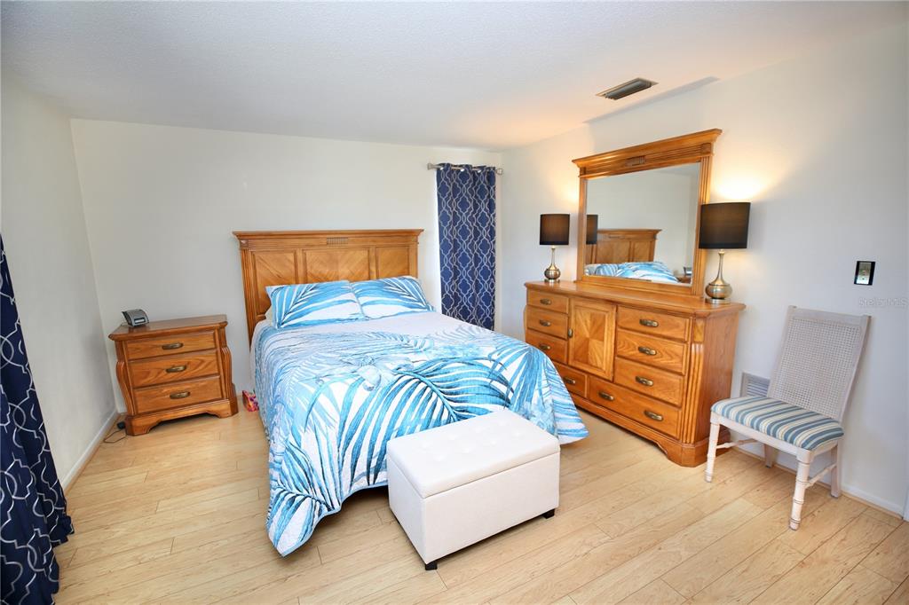 120 20th Street Southwest Largo, FL 33770 - Photo 28 of 46 a bedroom with a bed and furniture