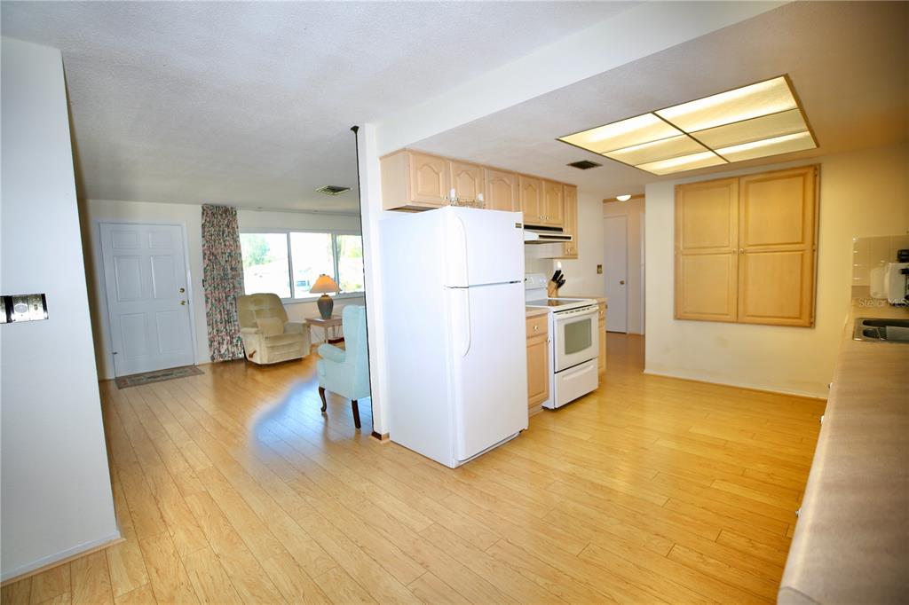 120 20th Street Southwest Largo, FL 33770 - Photo 32 of 46 a kitchen with a refrigerator a stove and a sink