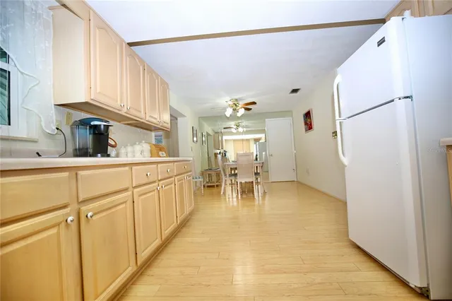a kitchen with sink cabinets and dining table