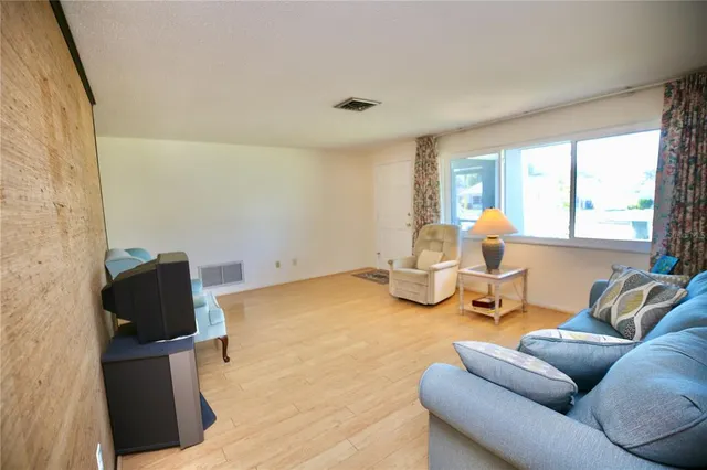 a living room with furniture and a table