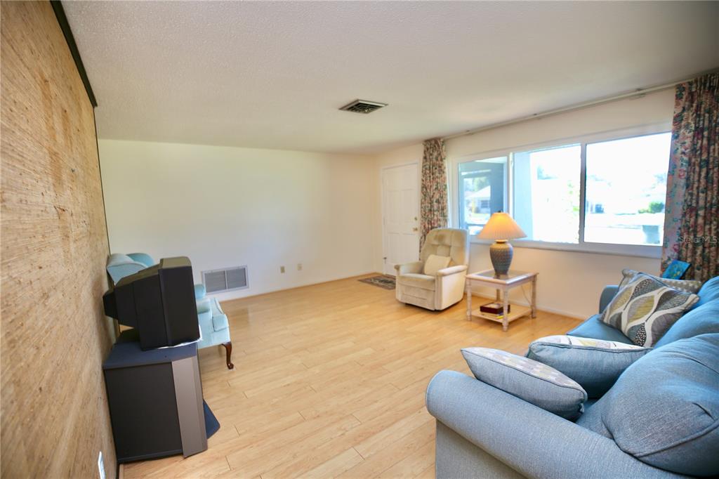 120 20th Street Southwest Largo, FL 33770 - Photo 37 of 46 a living room with furniture and a table