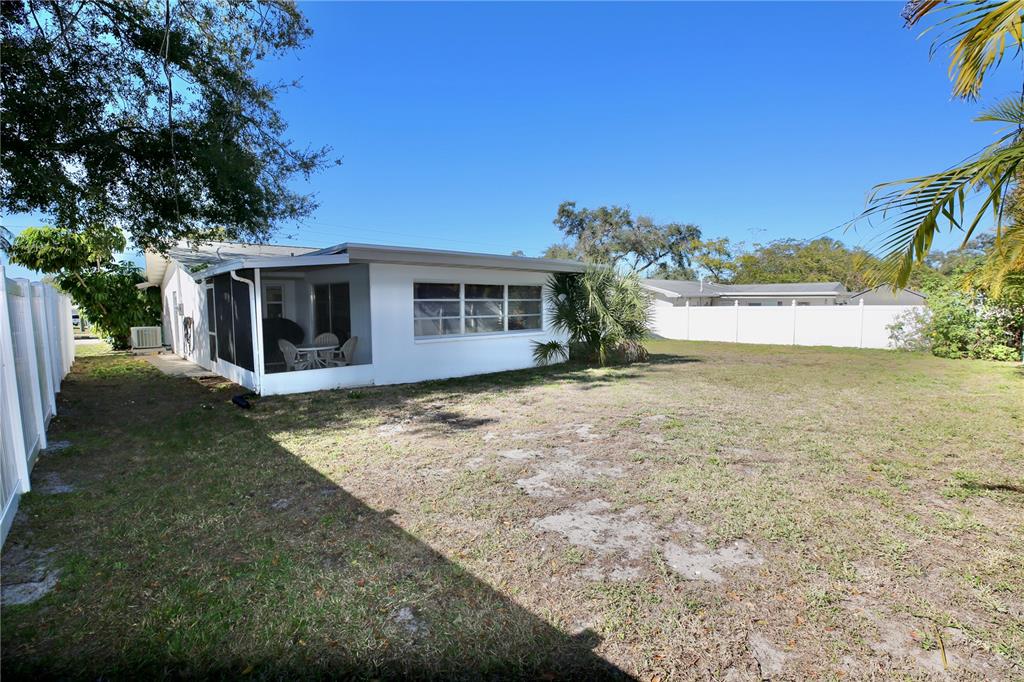 120 20th Street Southwest Largo, FL 33770 - Photo 45 of 46 a view of a house with backyard and a tree