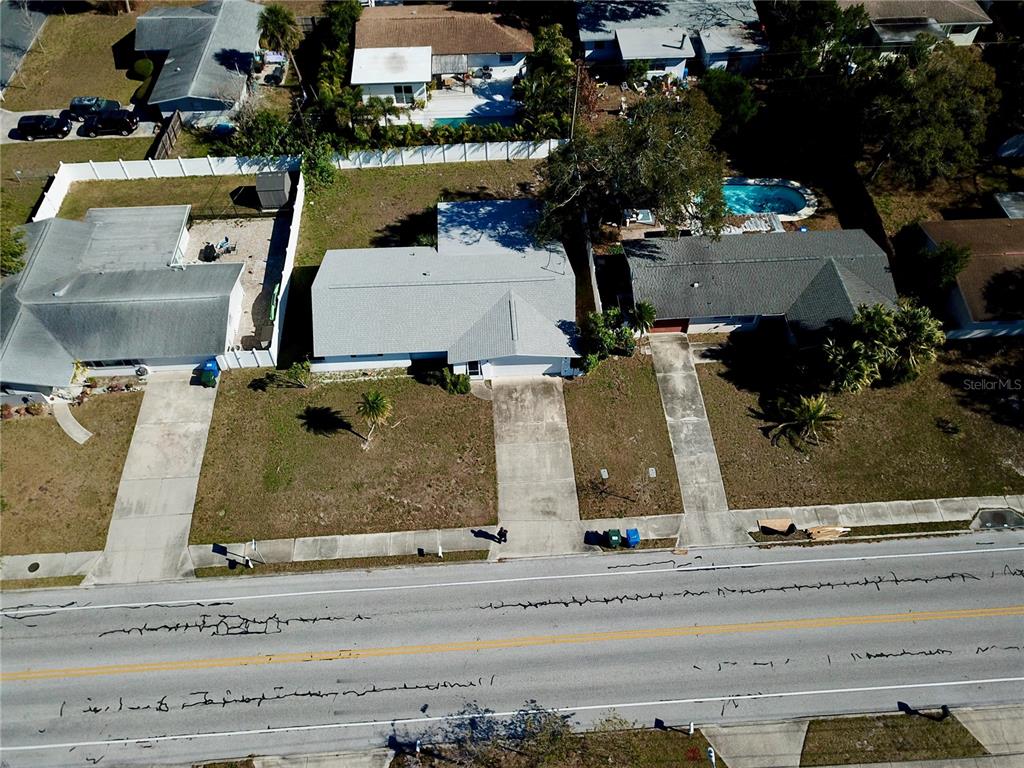 120 20th Street Southwest Largo, FL 33770 - Photo 8 of 46 an aerial view of a house with a swimming pool