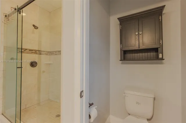 a bathroom with a shower and a sink