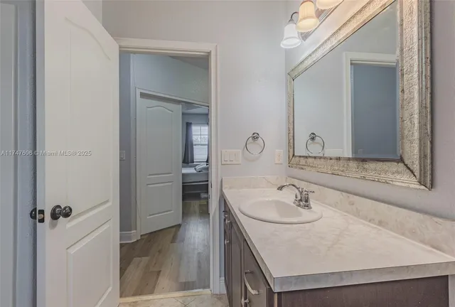 a bathroom with a sink and a mirror