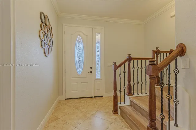 a view of an entryway with wooden floor