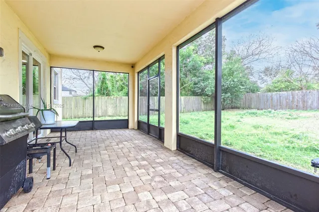 a view of an empty room with a large window