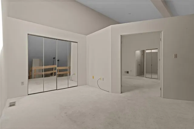 an empty room with sliding glass door