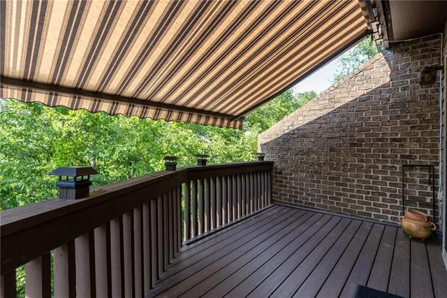 a view of balcony with wooden floor