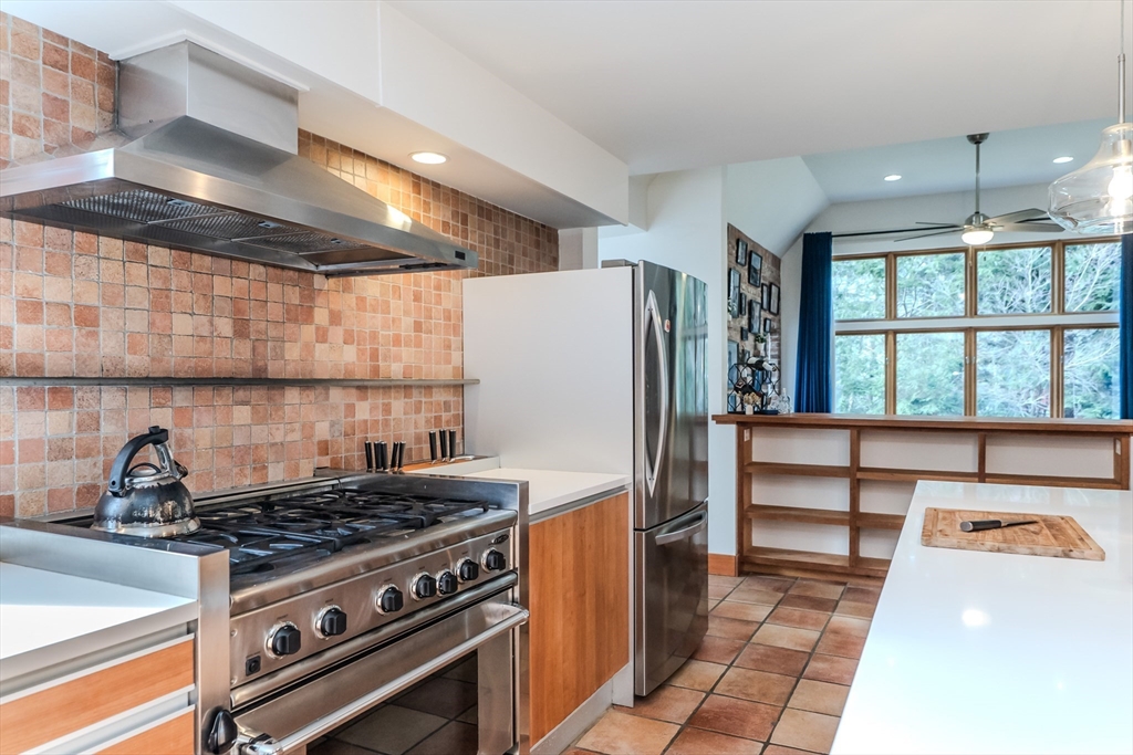 267 Shutesbury Road Amherst, MA 01002 - Photo 8 of 42 a kitchen with a stove and a refrigerator