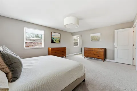 a bed room with a bed and a tv