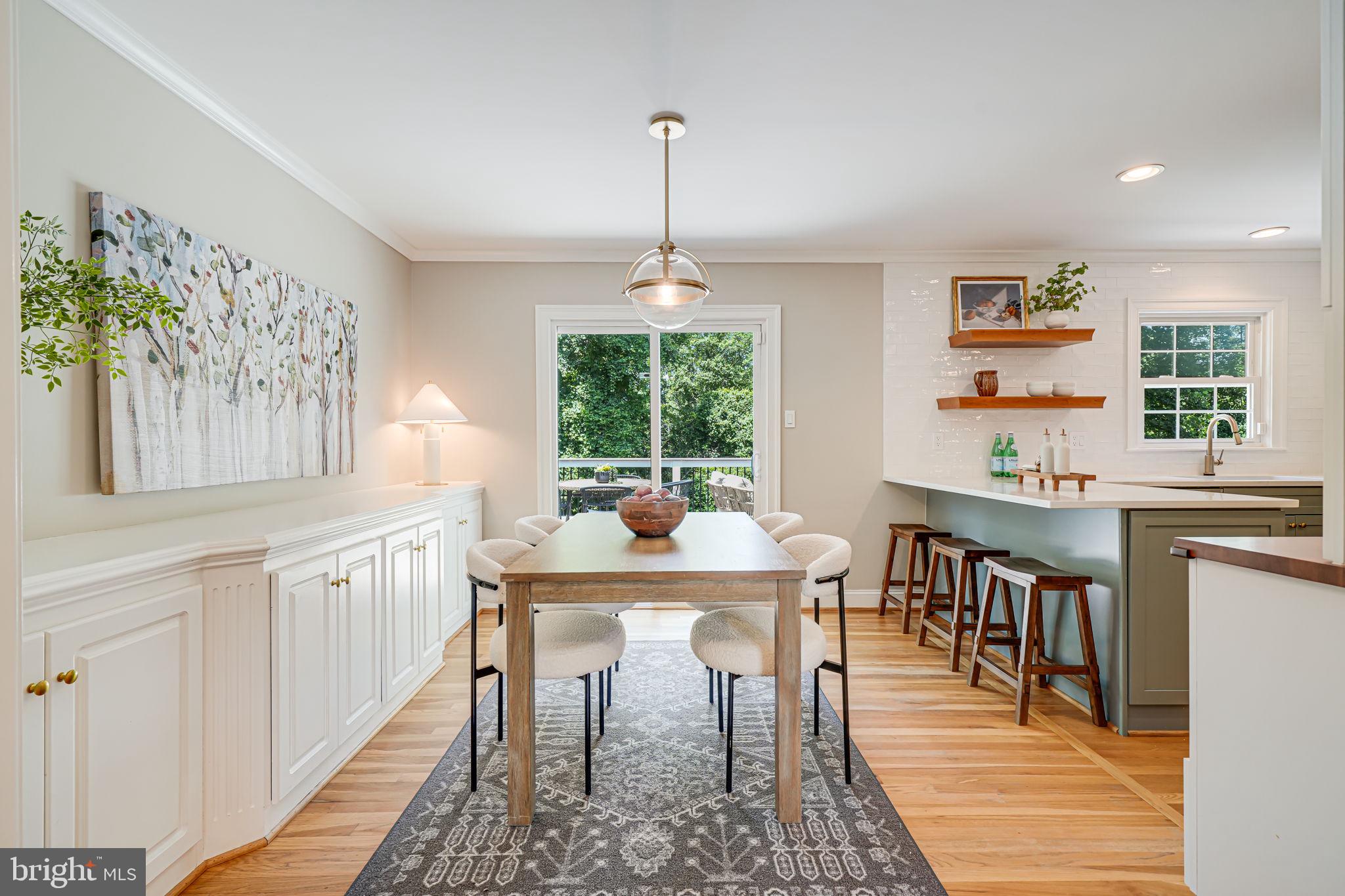1930 Foxhall Road McLean, VA 22101 - Photo 11 of 62 a dining room with chandelier and wooden floor