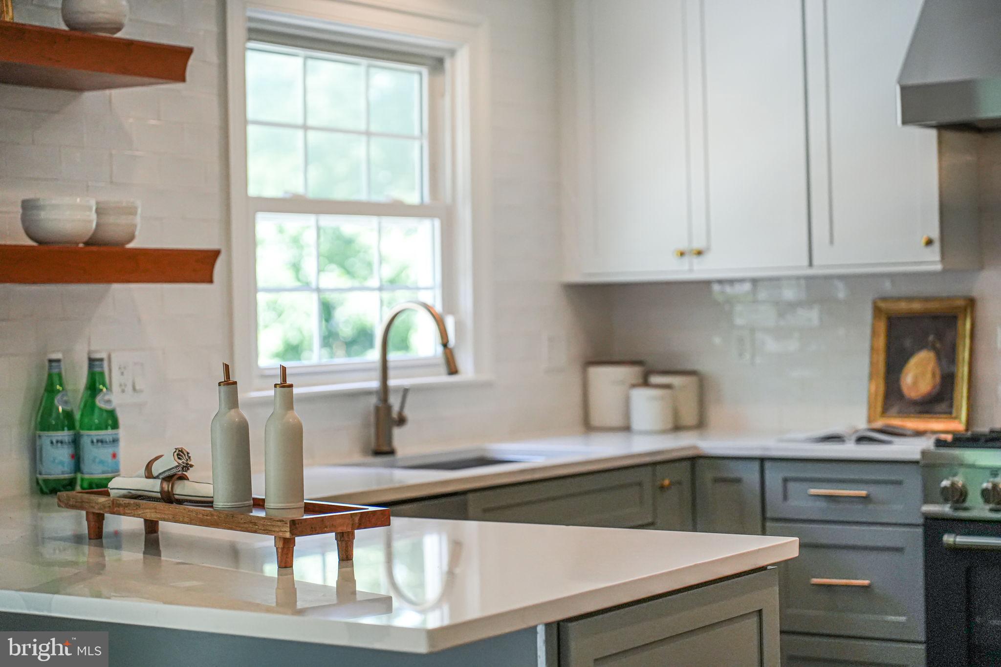 1930 Foxhall Road McLean, VA 22101 - Photo 17 of 62 a kitchen with stainless steel appliances granite countertop a sink a stove and a window