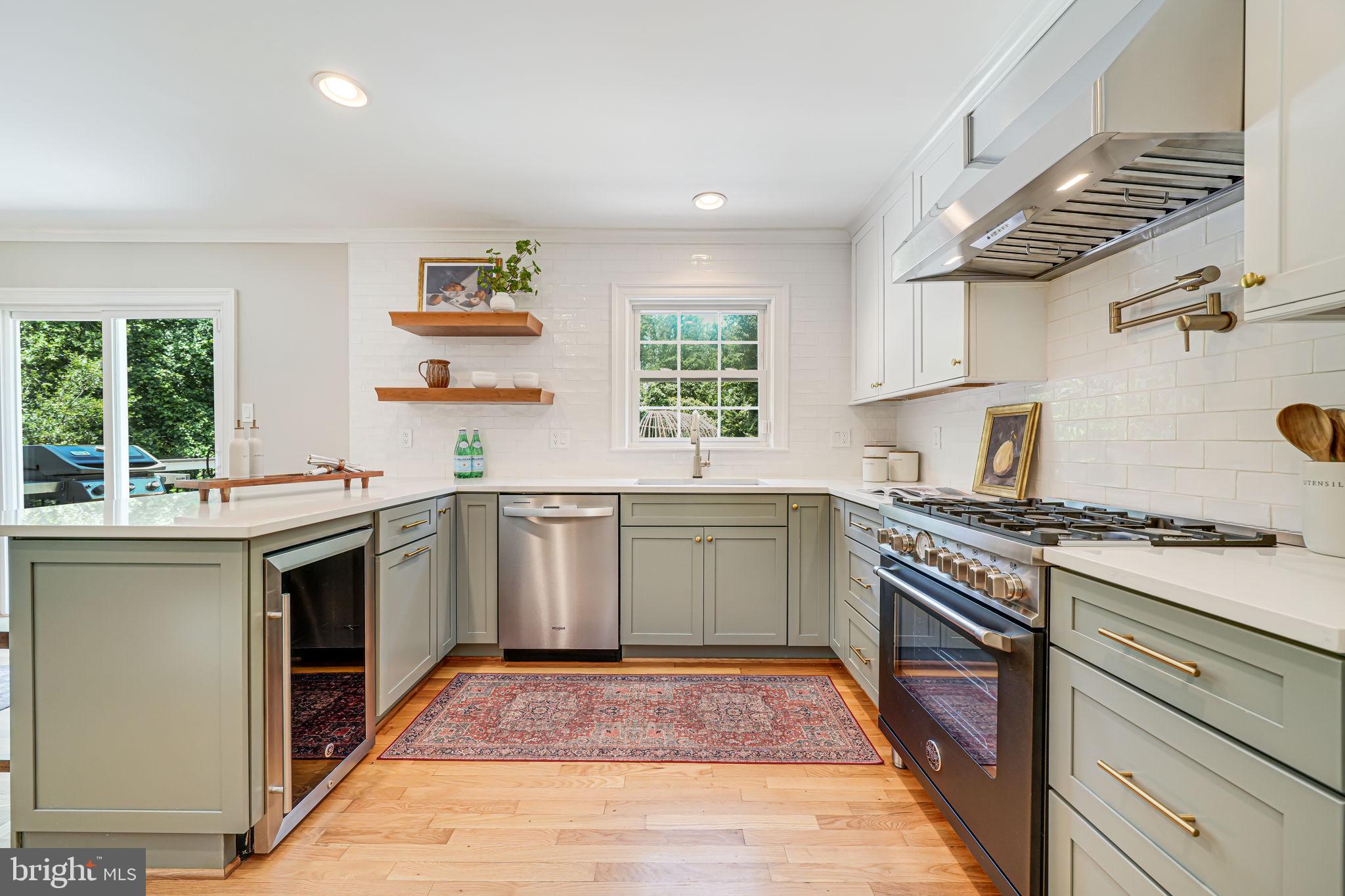 1930 Foxhall Road McLean, VA 22101 - Photo 18 of 62 a kitchen with a stove top oven sink and cabinets