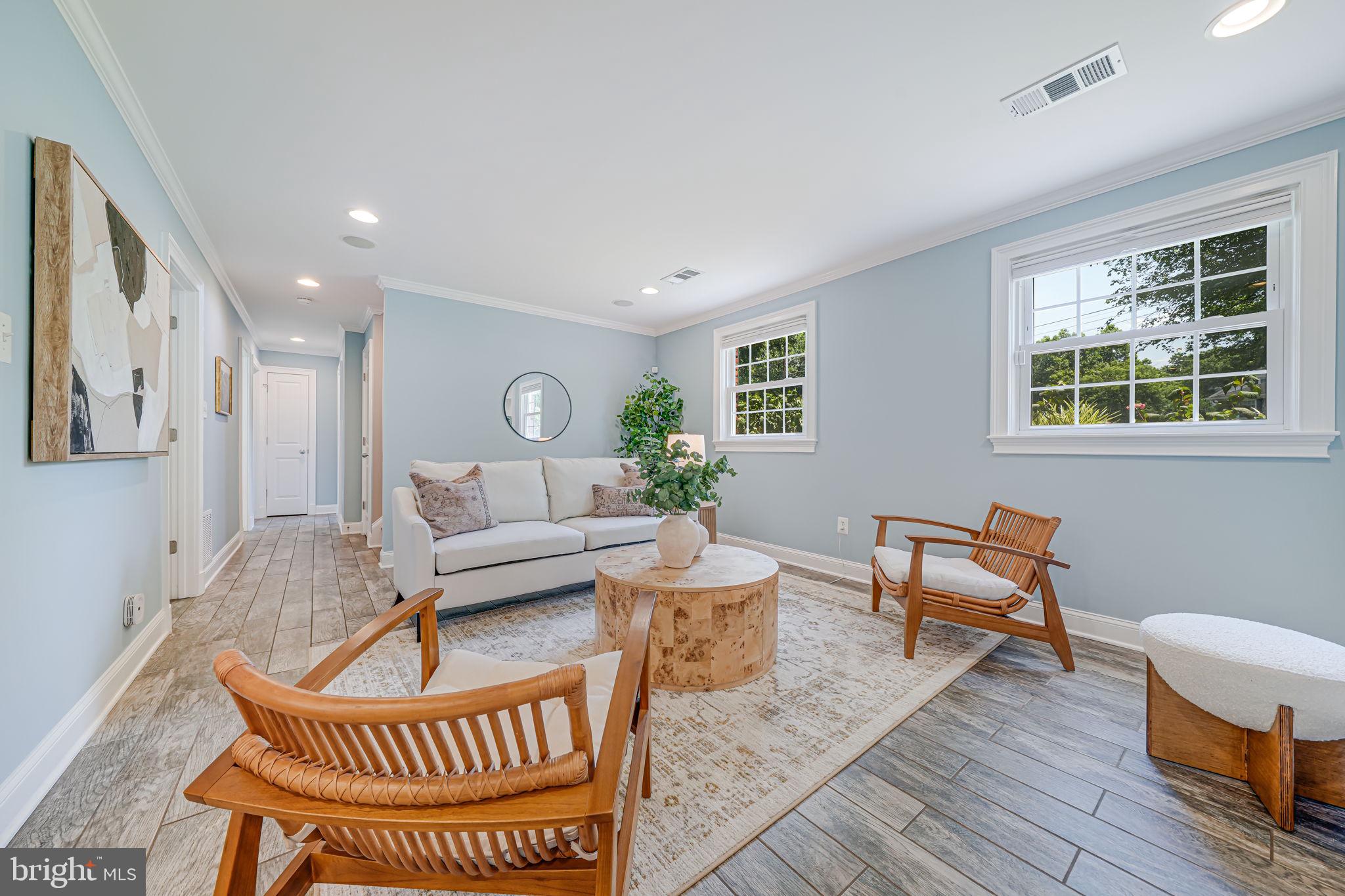 1930 Foxhall Road McLean, VA 22101 - Photo 30 of 62 a living room with furniture a wooden floor and a window