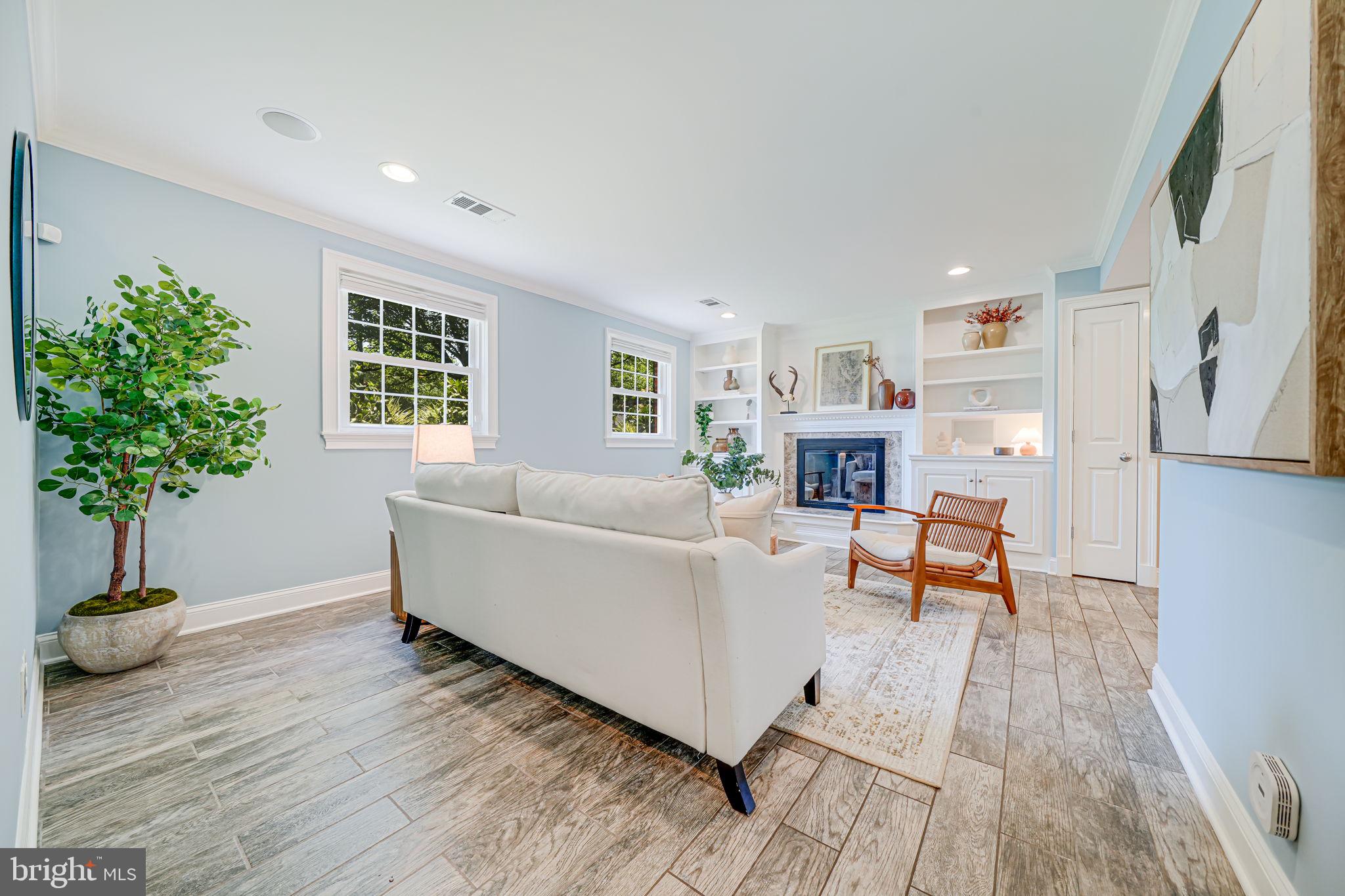 1930 Foxhall Road McLean, VA 22101 - Photo 32 of 62 a living room with furniture and a fireplace