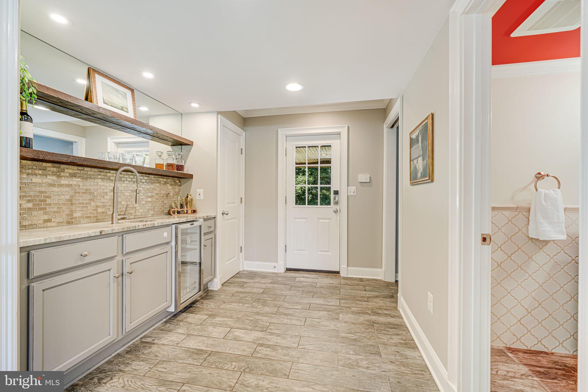 1930 Foxhall Road McLean, VA 22101 - Photo 34 of 62 a bathroom with a sink and mirror