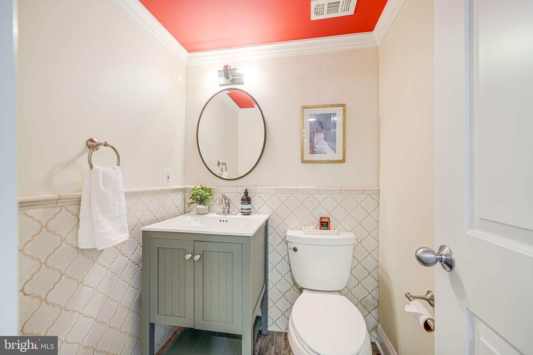 1930 Foxhall Road McLean, VA 22101 - Photo 37 of 62 a bathroom with a toilet a sink and mirror