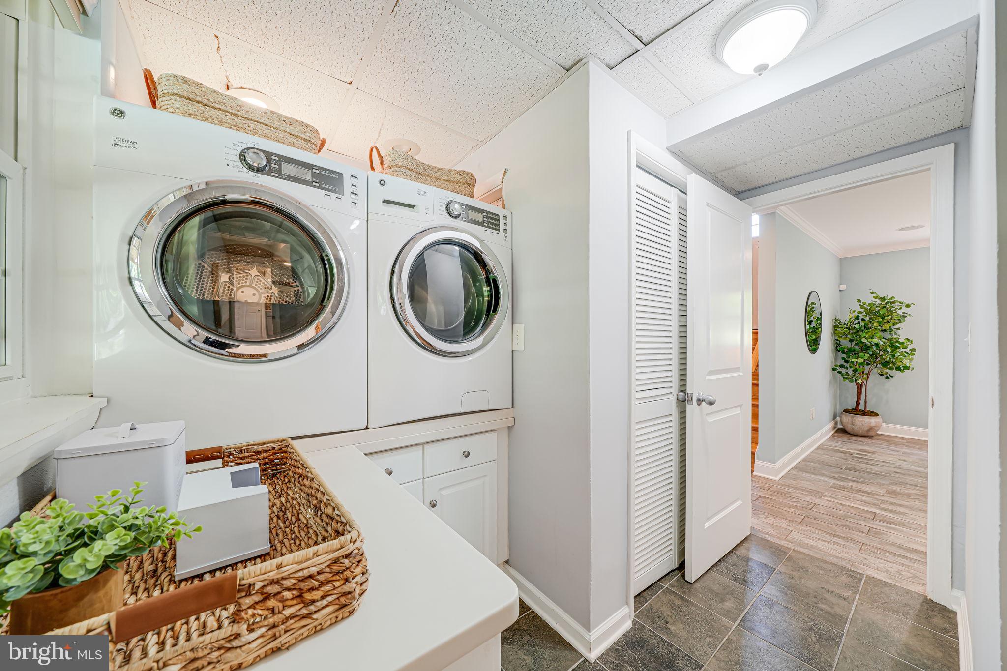 1930 Foxhall Road McLean, VA 22101 - Photo 40 of 62 a view of a storage & utility room with washer and dryer