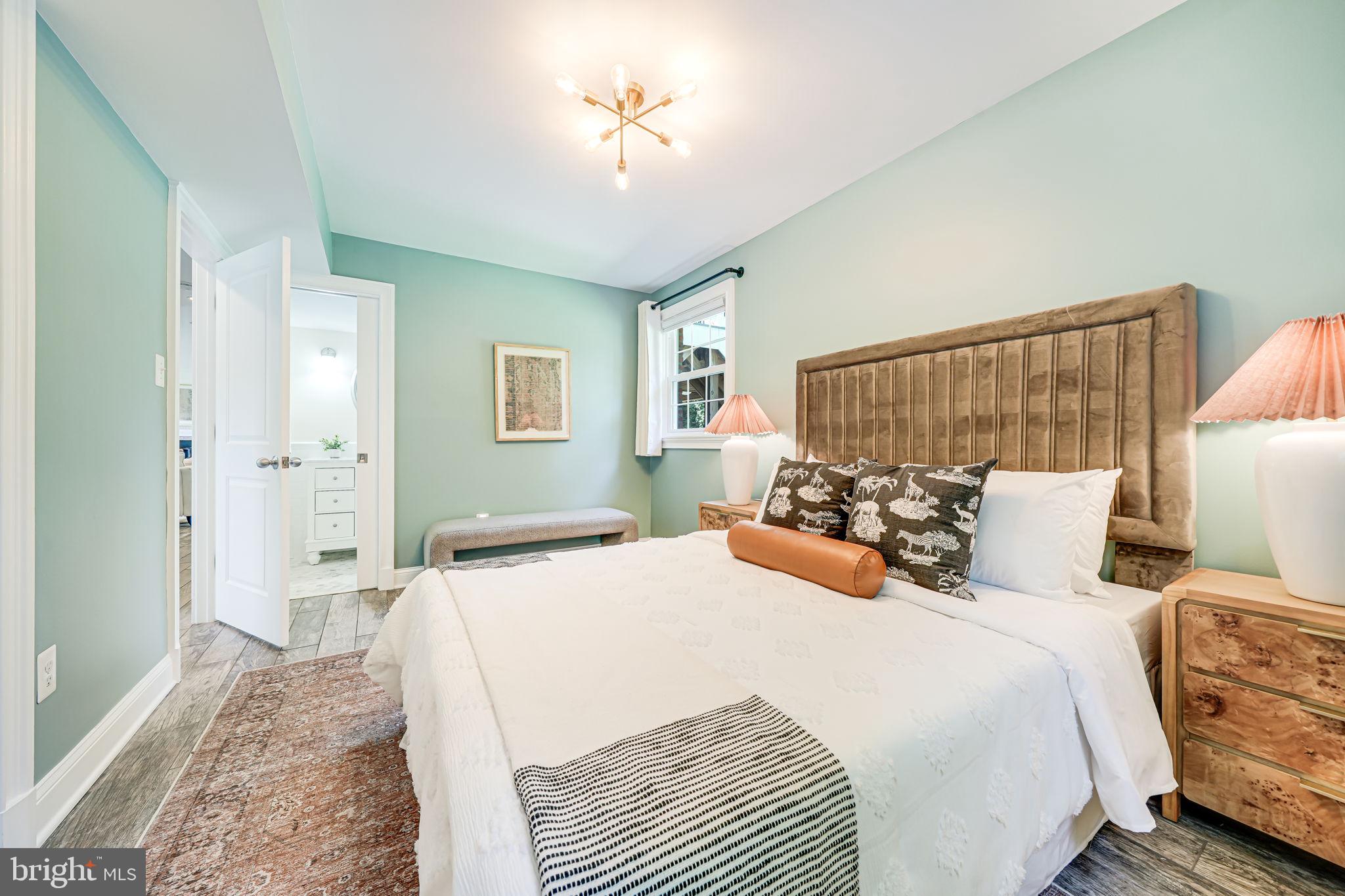 1930 Foxhall Road McLean, VA 22101 - Photo 44 of 62 a bedroom with a bed and a chandelier