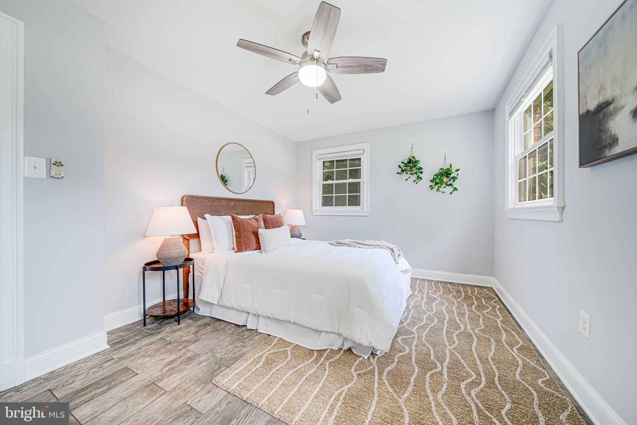 1930 Foxhall Road McLean, VA 22101 - Photo 47 of 62 a bedroom with a bed window and a ceiling fan