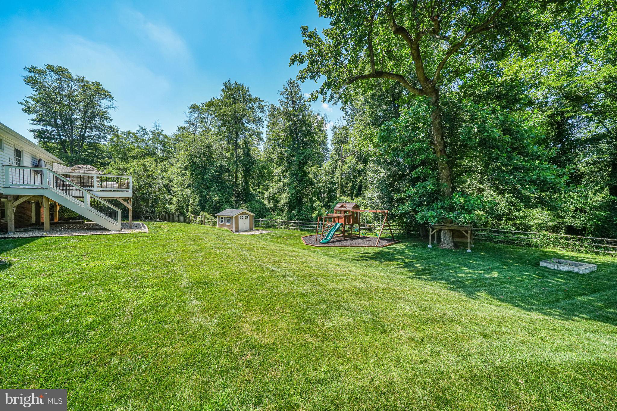 1930 Foxhall Road McLean, VA 22101 - Photo 56 of 62 a view of a house with backyard and a slide
