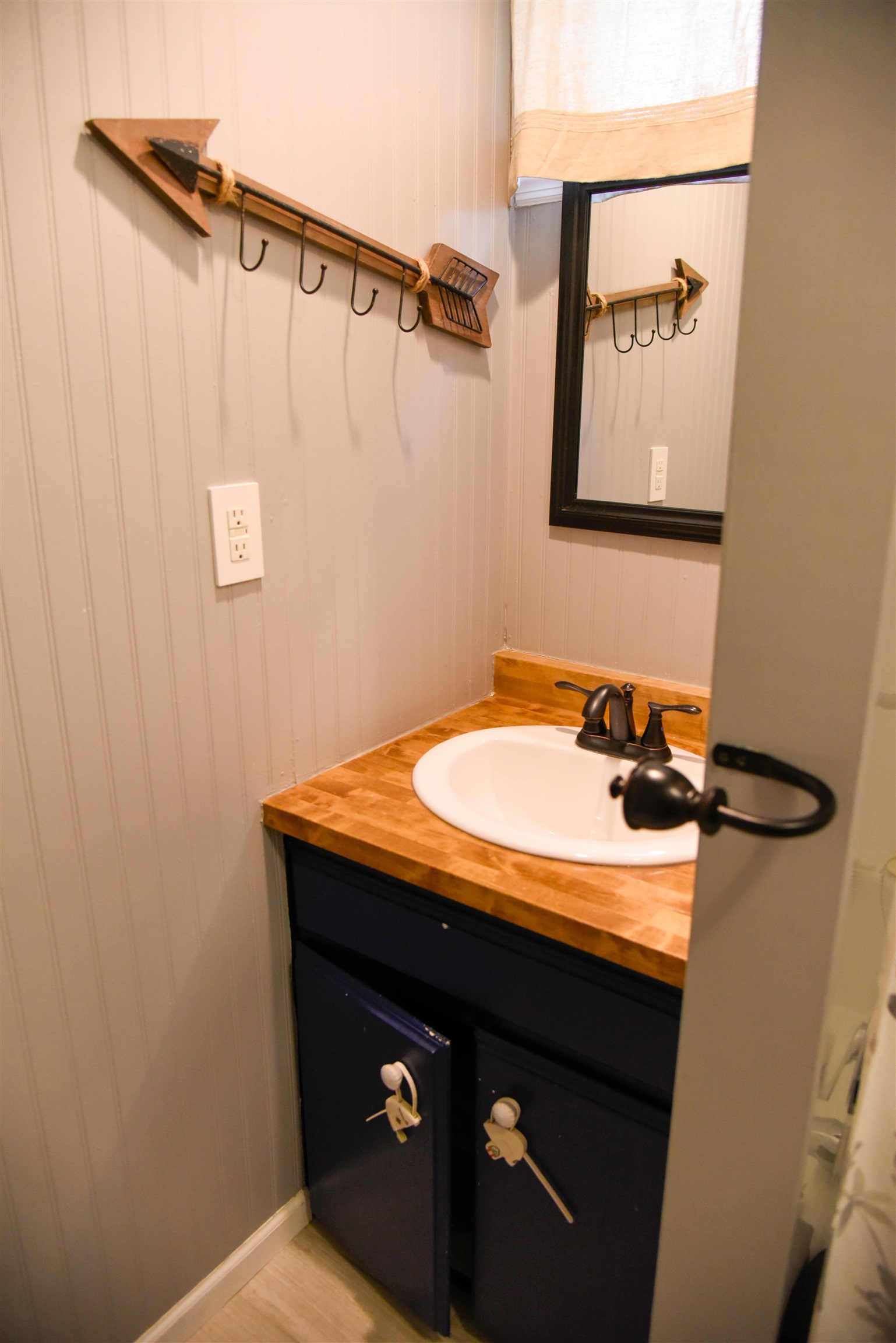 120 North Booth Street Dubuque, IA 52001 - Photo 18 of 26 a bathroom with a sink and mirror with toilet