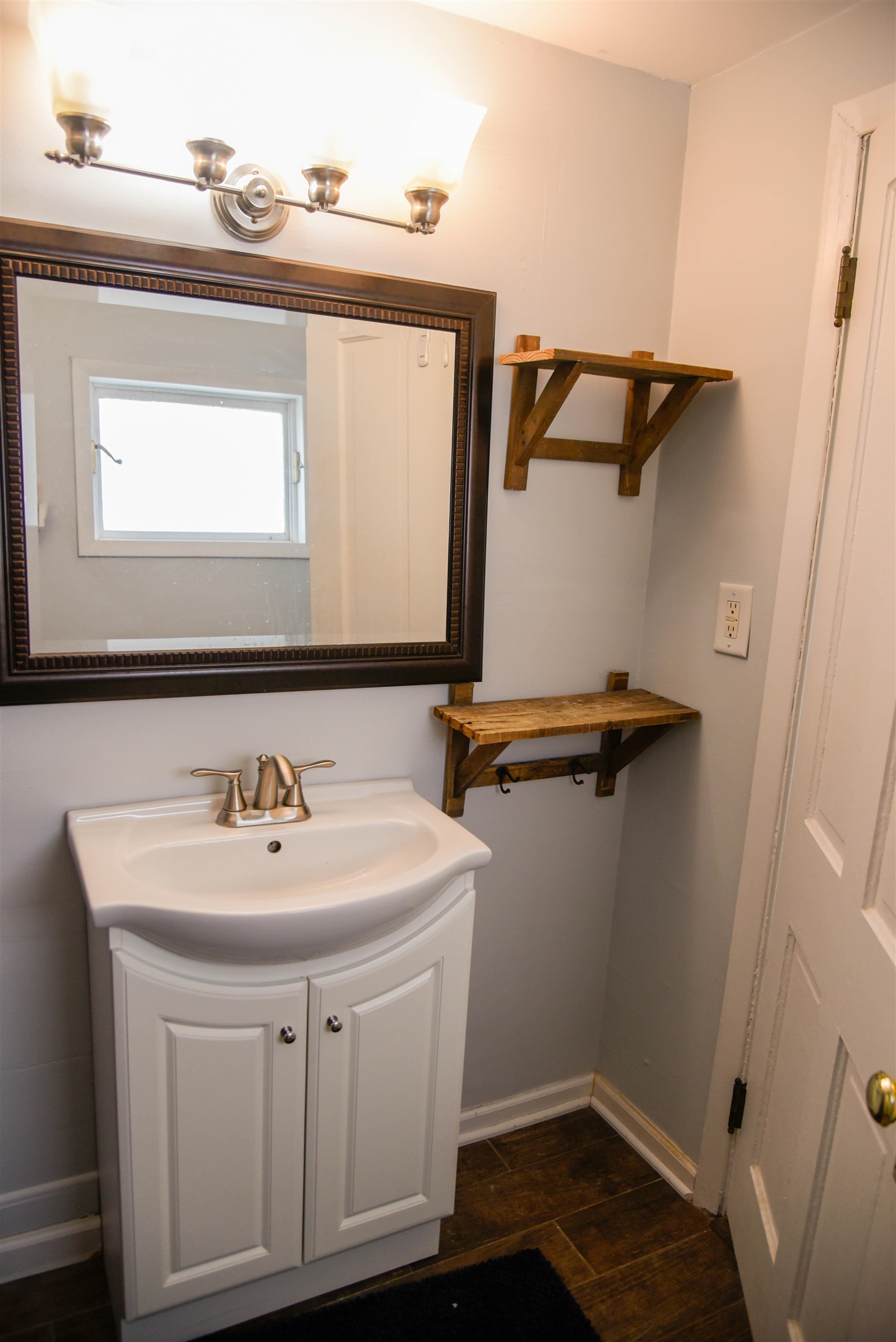 120 North Booth Street Dubuque, IA 52001 - Photo 20 of 26 a bathroom with a sink and a mirror