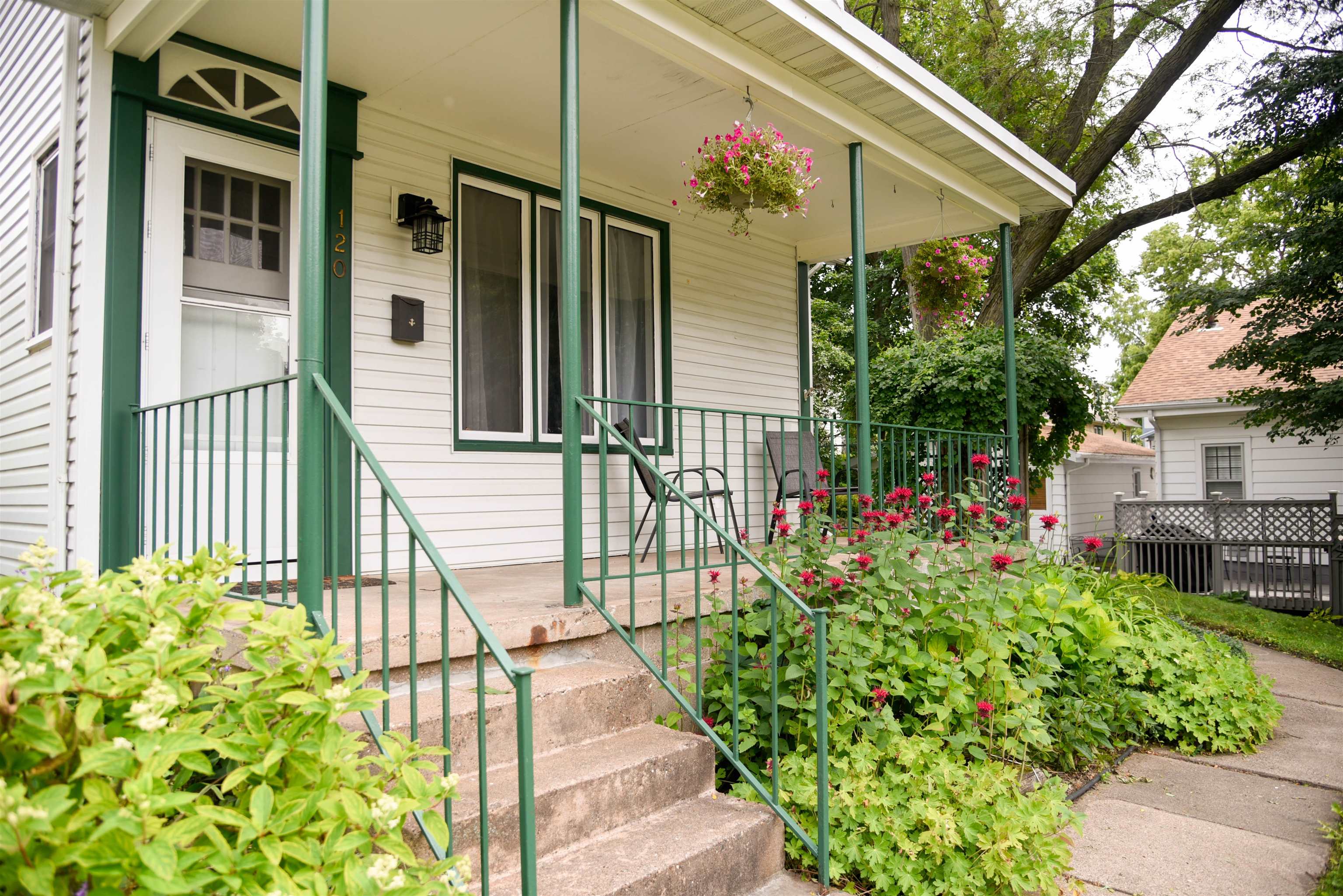 120 North Booth Street Dubuque, IA 52001 - Photo 2 of 26 a view of a house with a flower garden