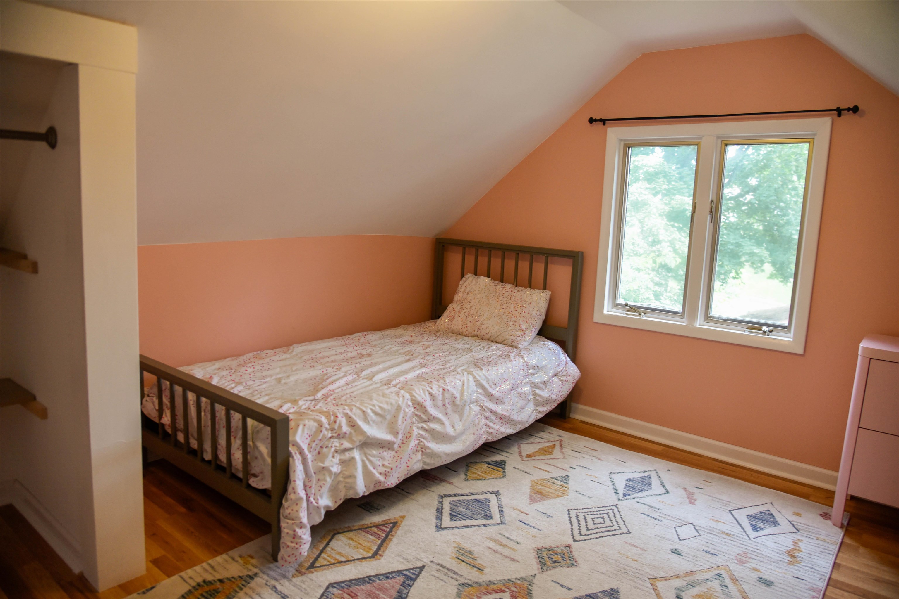120 North Booth Street Dubuque, IA 52001 - Photo 26 of 26 a bedroom with a bed and wooden floor