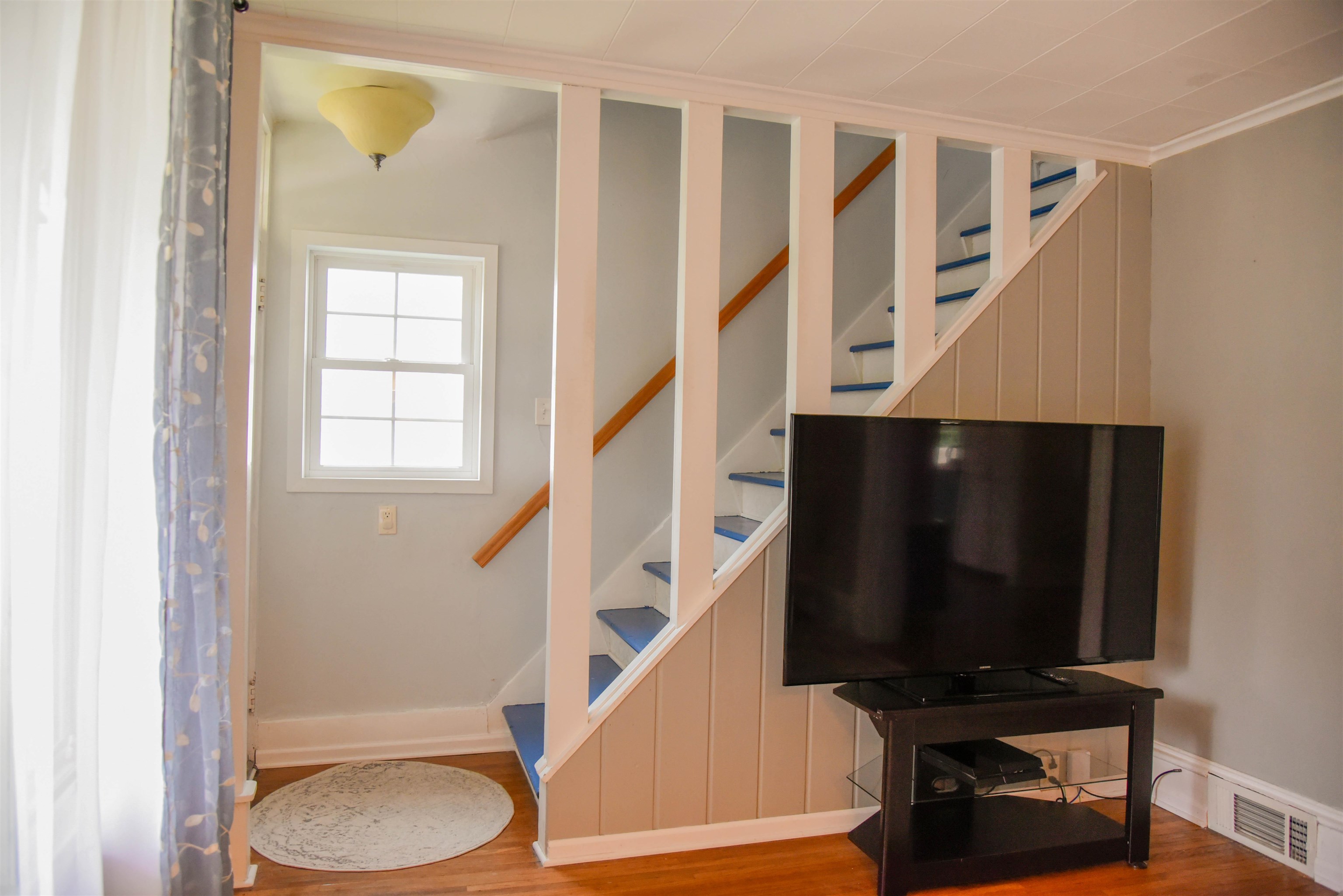 120 North Booth Street Dubuque, IA 52001 - Photo 7 of 26 a view of entryway with wooden floor and staircase