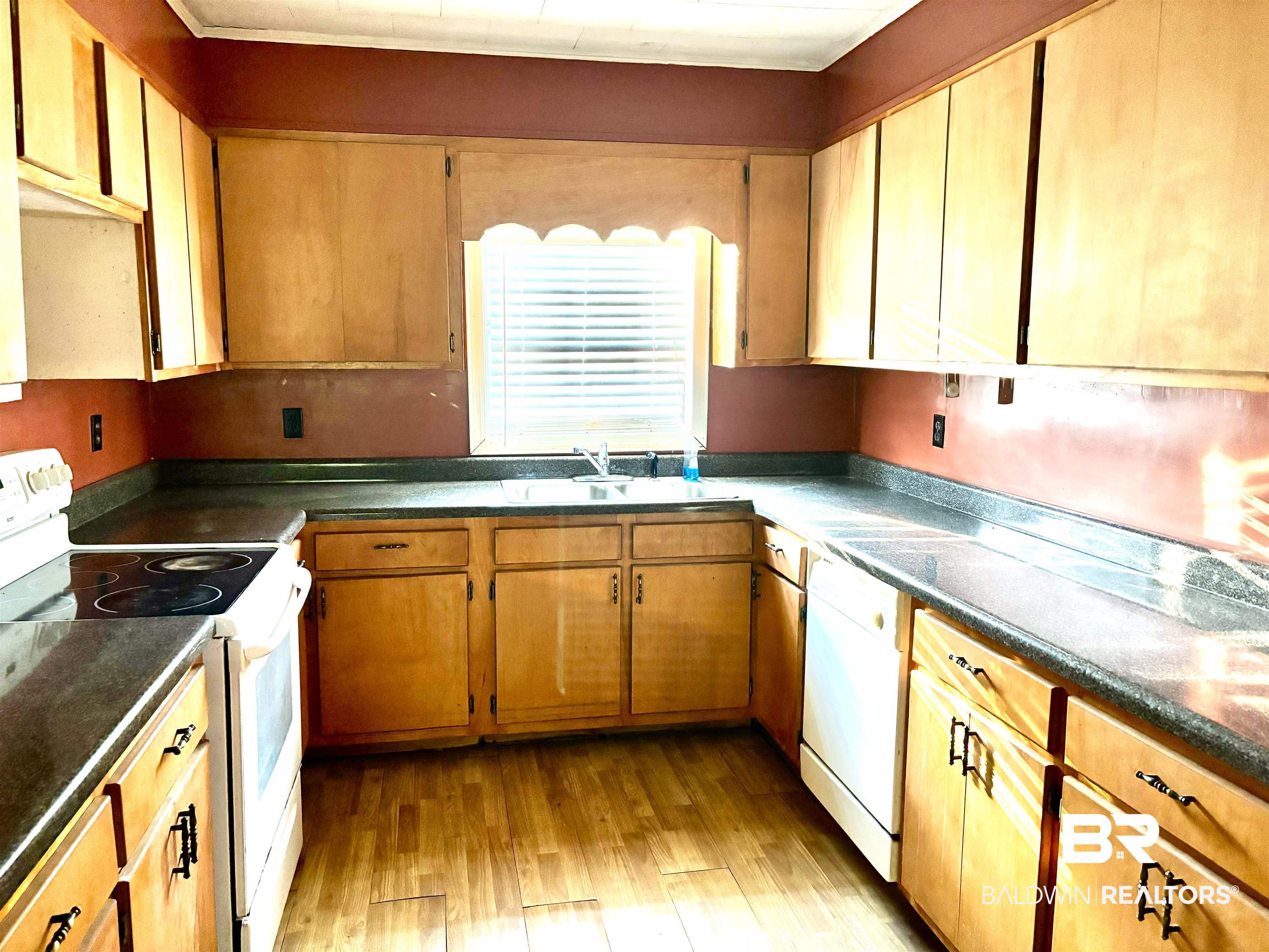 17495 County Road 48 Robertsdale, AL 36567 - Photo 21 of 37 Kitchen featuring white appliances, light hardwood / wood-style floors, and sink