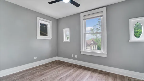 a view of an empty room and wooden floor