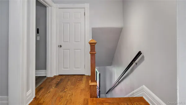 a view of entryway with wooden floor