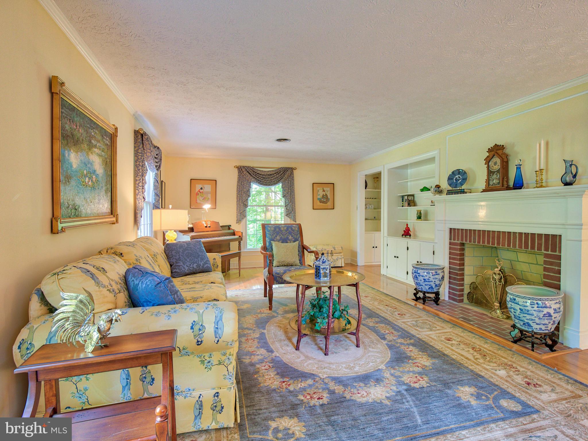 2469 Jones Road Winchester, VA 22602 - Photo 9 of 47 Formal living room with brick fire[lace