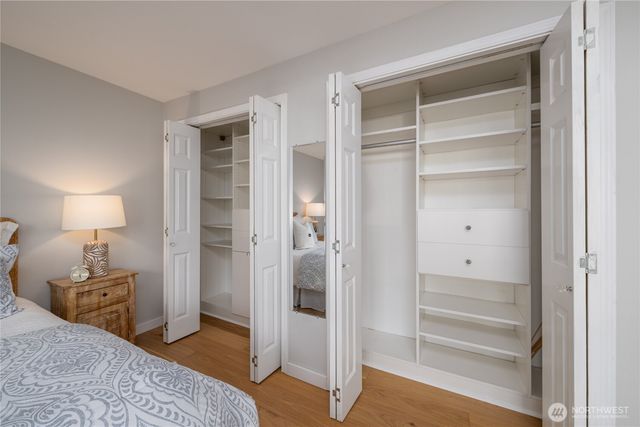 a bedroom with a bed and a closet