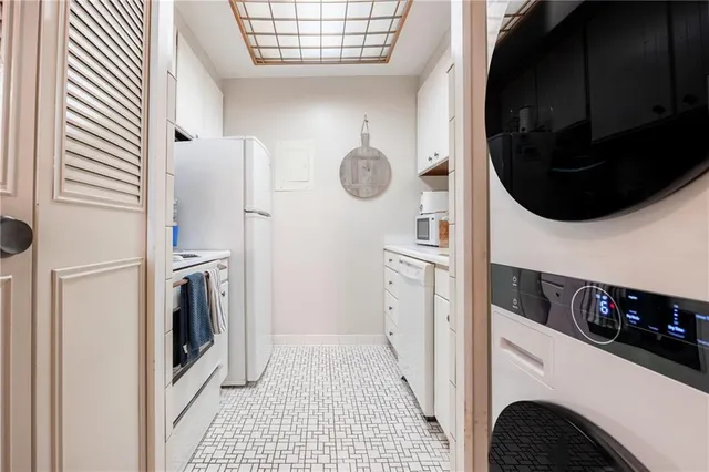 a view of a kitchen with washer and dryer