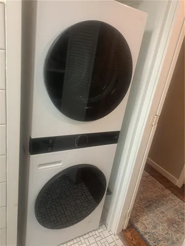 a close view of a utility room with dryer and washer