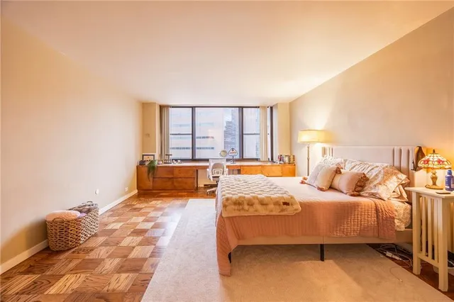 a bedroom with a bed and a couch