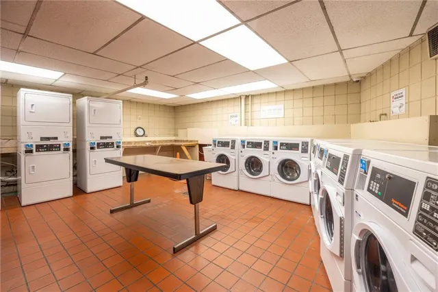 a kitchen with a sink a stove and cabinets
