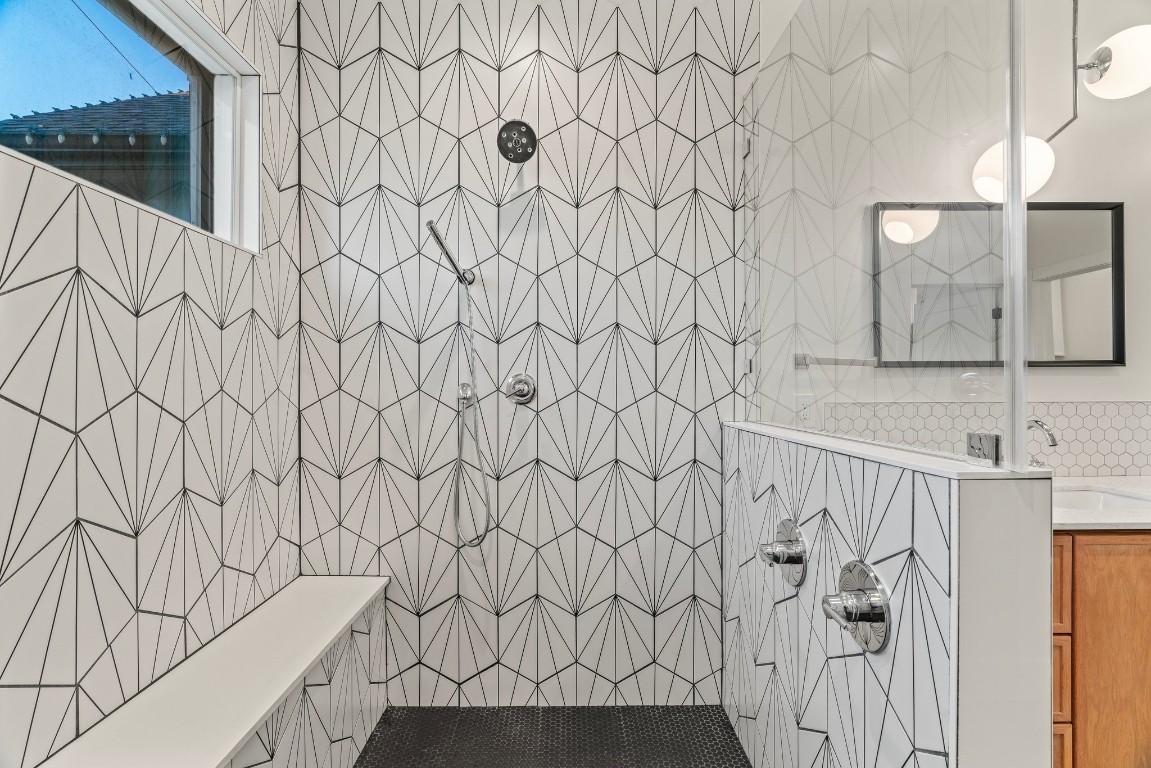 3802 Commerce Street Houston, TX 77003 - Photo 27 of 45 Beautiful primary shower area showcasing eye-catching tilework.