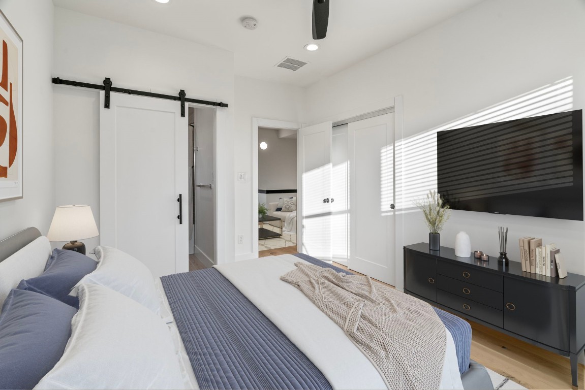 3802 Commerce Street Houston, TX 77003 - Photo 32 of 45 Bright and generously sized secondary bedroom offering high ceilings, a walk-in closet, and a private ensuite bath, providing comfort and privacy for guests.