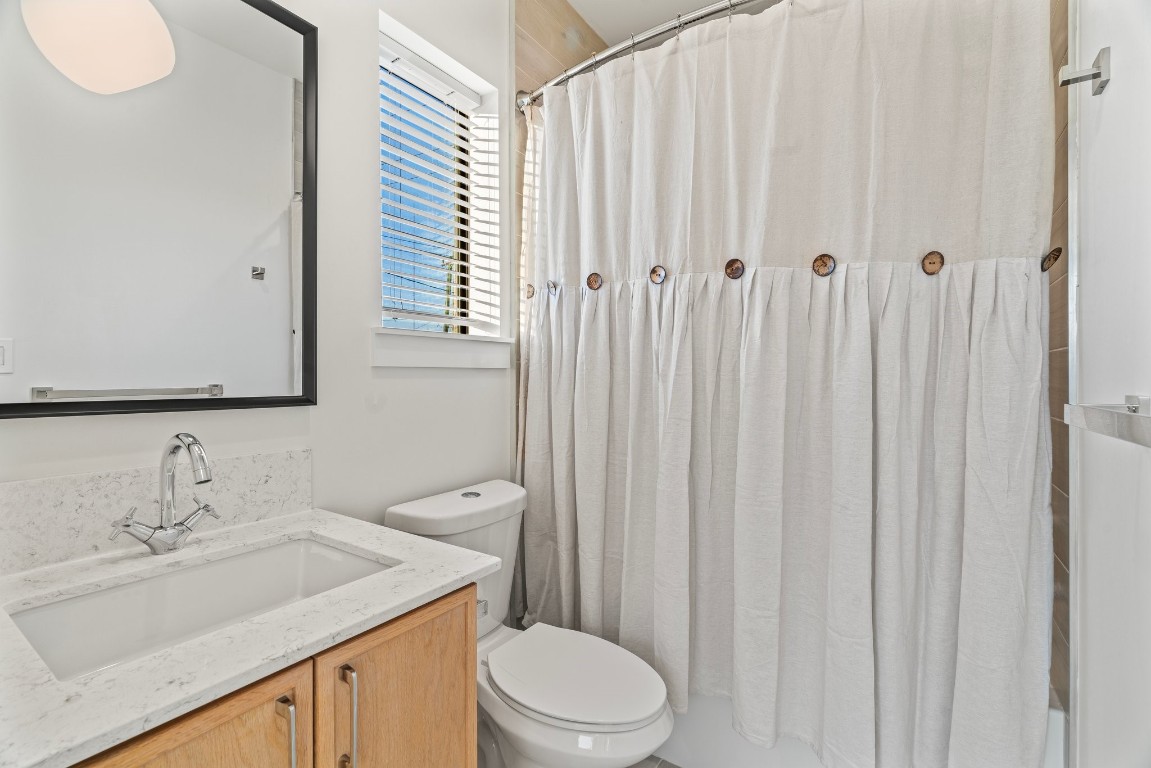 3802 Commerce Street Houston, TX 77003 - Photo 33 of 45 Beautifully appointed ensuite bathroom with quartz countertops, modern finishes, and bright, elegant lighting.