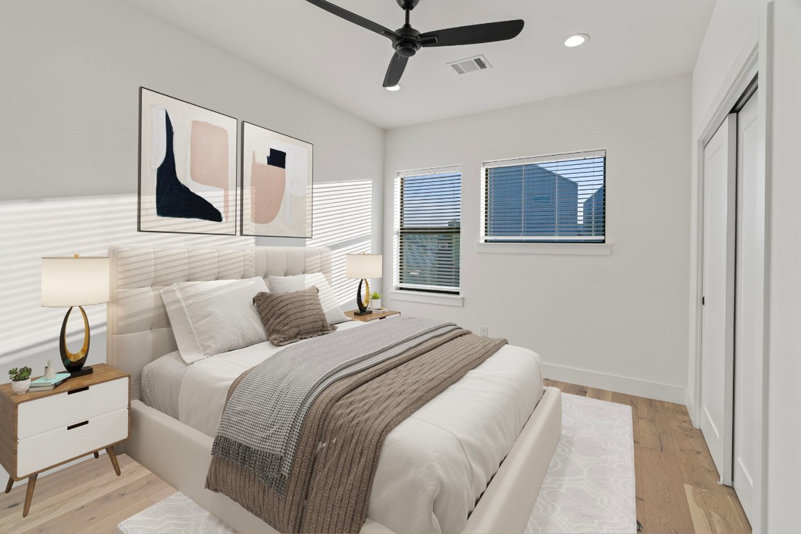 3802 Commerce Street Houston, TX 77003 - Photo 35 of 45 Spacious and inviting secondary bedroom with ensuite bath, conveniently positioned with direct access to the second living area—ideal for guests or flexible use.