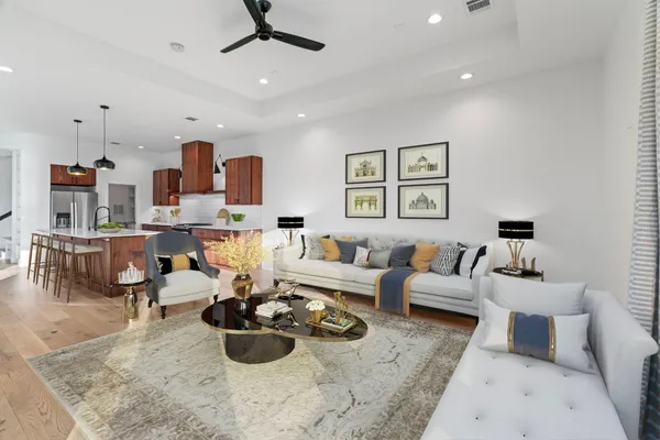 a living room with furniture and a painting