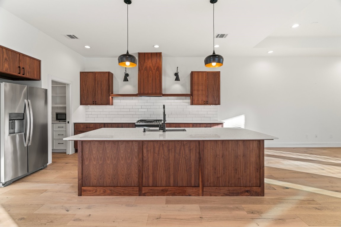 3802 Commerce Street Houston, TX 77003 - Photo 9 of 45 Sleek, open-concept kitchen that flows effortlessly into the dining and living areas, perfect for hosting or unwinding after work.