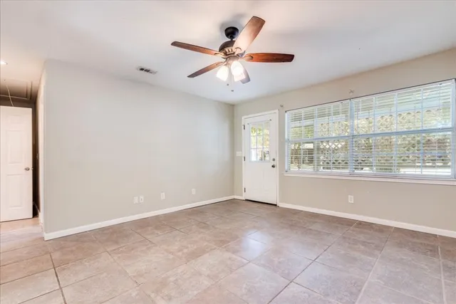 a view of an empty room with a window