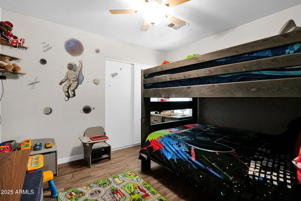 a living room with baby toys and dresser