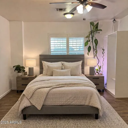 a bedroom with a bed and window