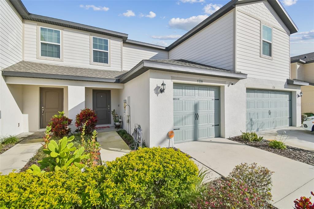 5228 New Friendship Place Tampa, FL 33619 - Photo 1 of 49 a front view of house with yard outdoor seating and barbeque oven